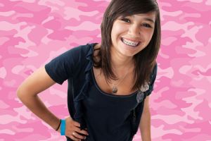 Smiling young woman with traditional braces | Life After Braces