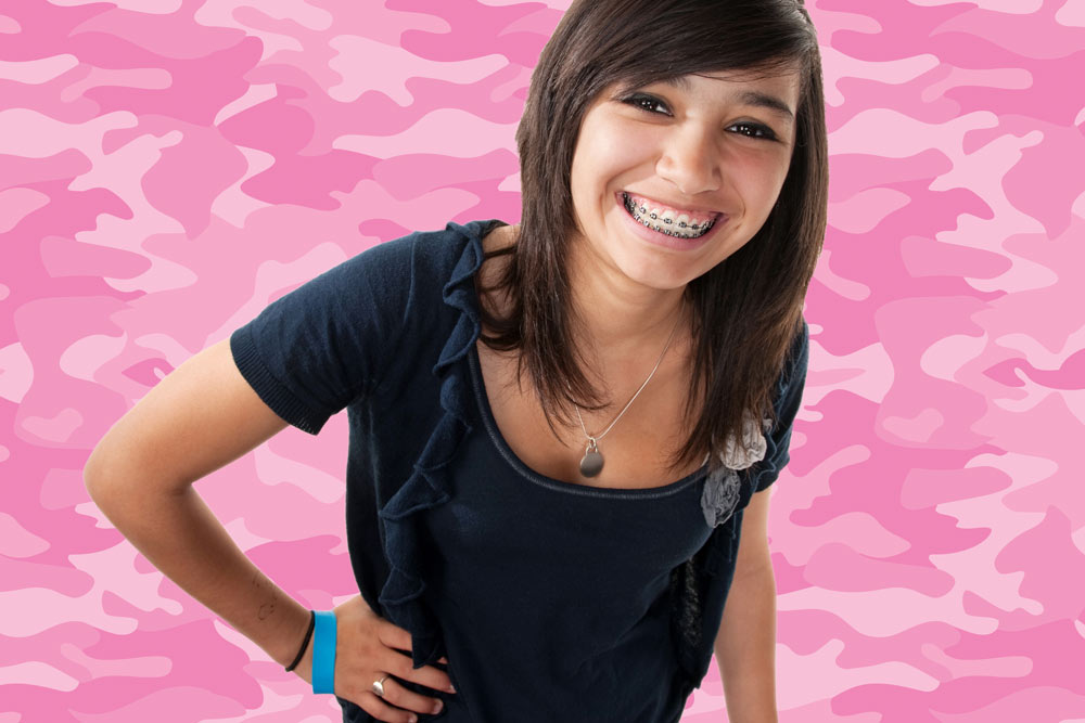 Smiling young woman with traditional braces | Life After Braces